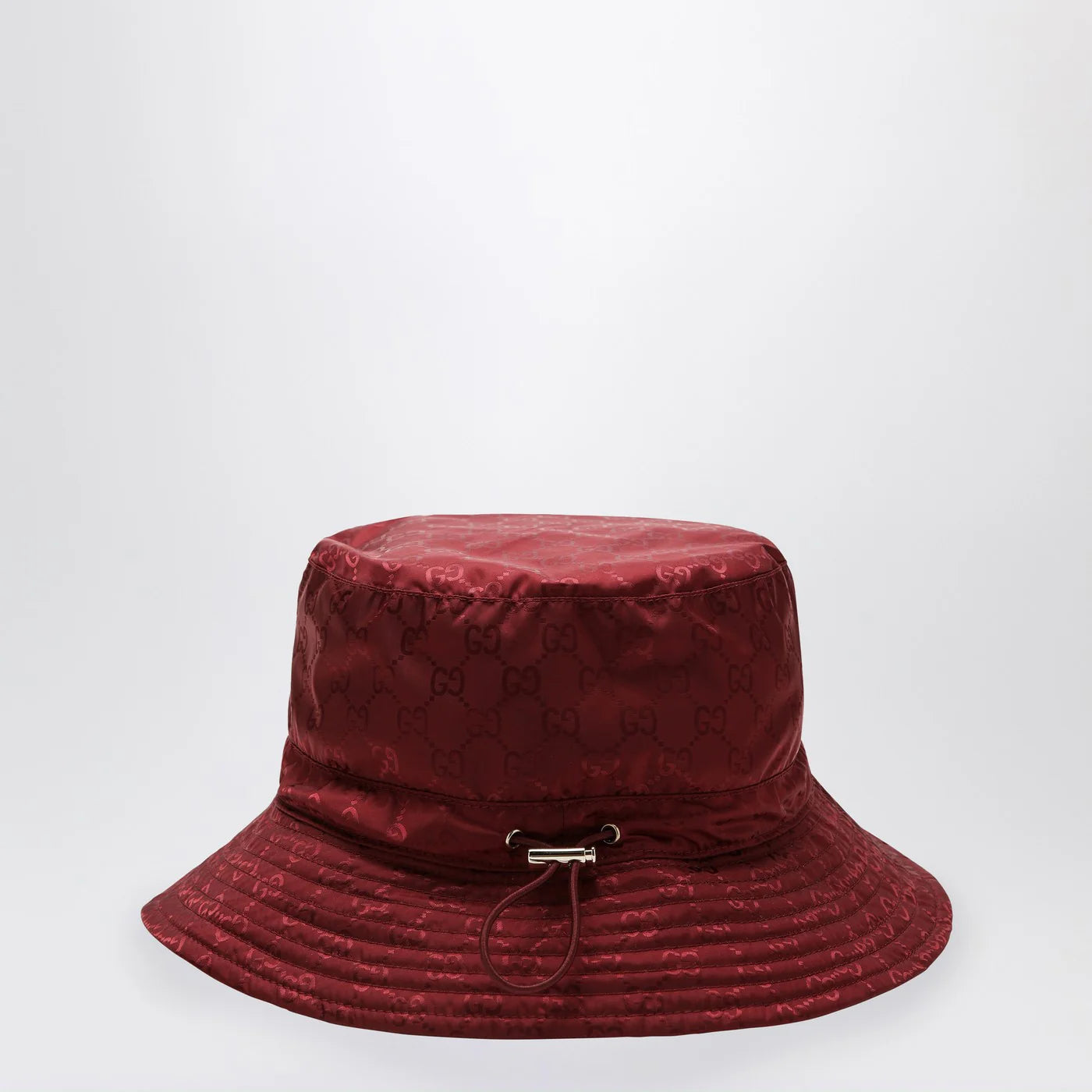 GUCCI Reversible burgundy nylon GG hat