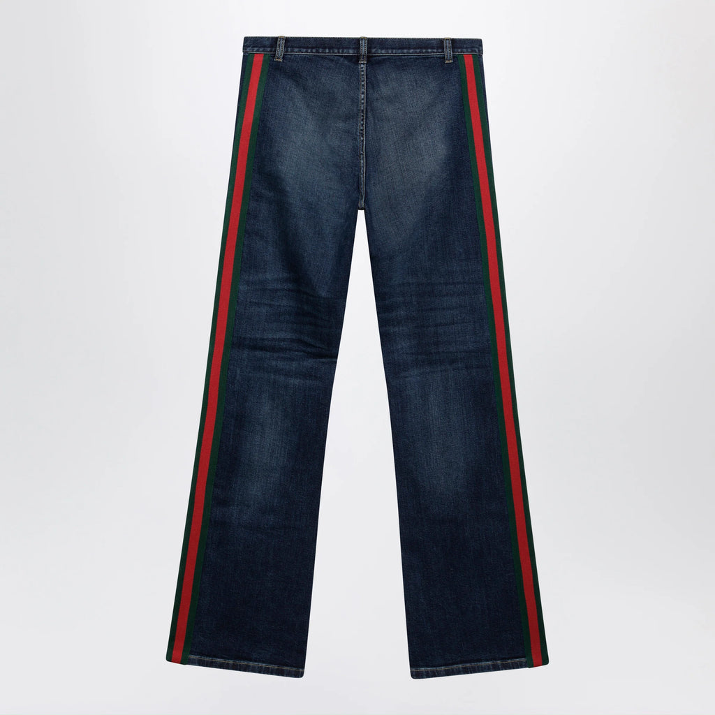 GUCCI Low-rise cotton denim Web tape trousers in blue