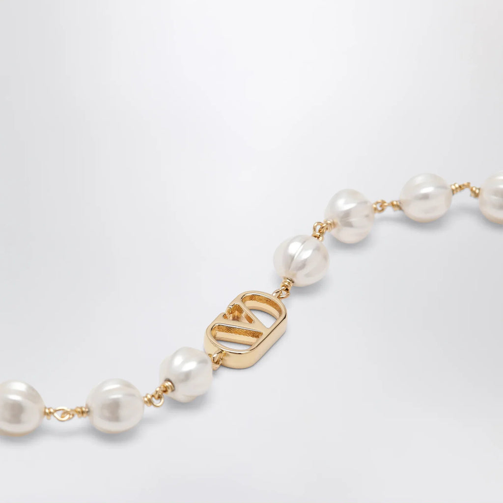 Valentino Garavani VLogo Signature bracelet in metal and pearls, gold/cream