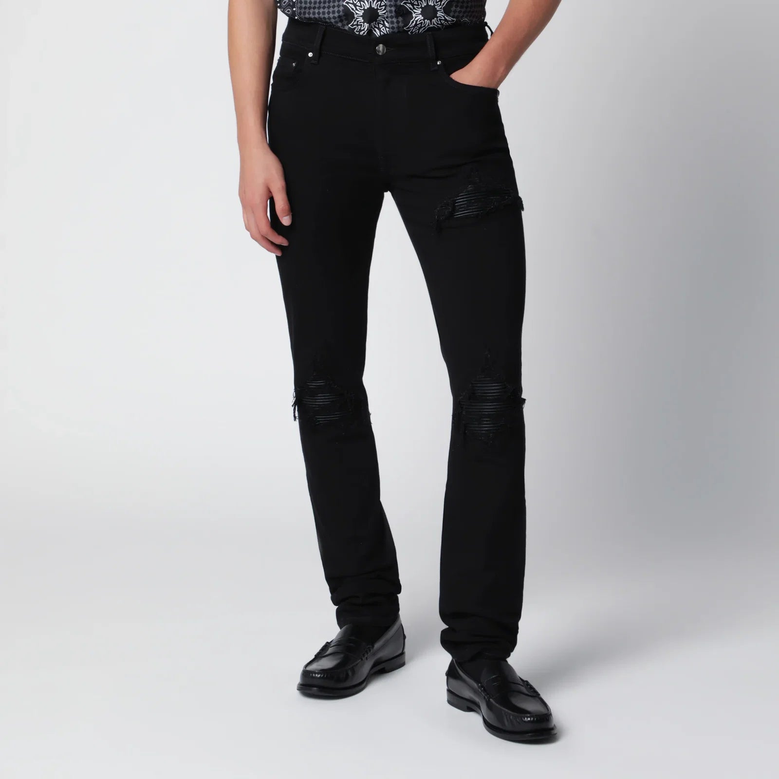 AMIRI Ripped skinny cotton jeans in black
