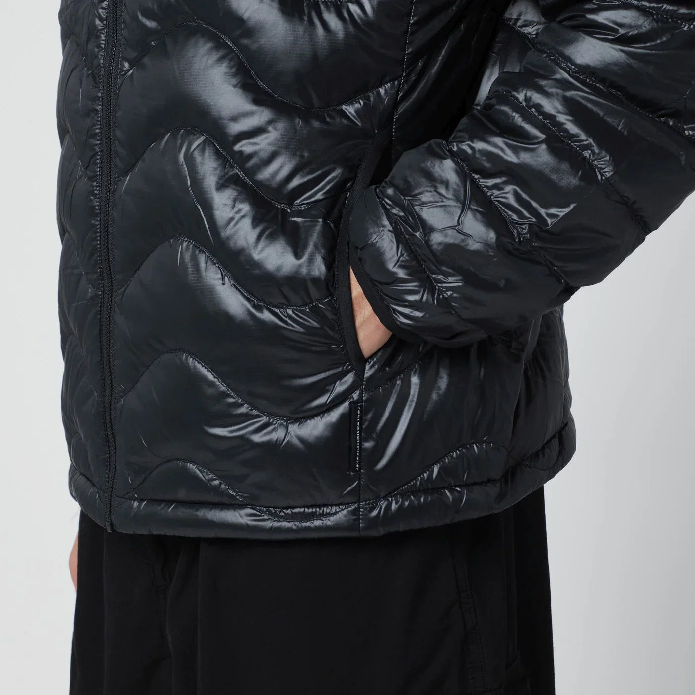 Purple Mountain Observatory Black Waves hooded puffer jacket
